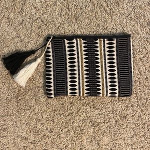 Single sleeve clutch in neutrals and gold weave with tassels tribal design